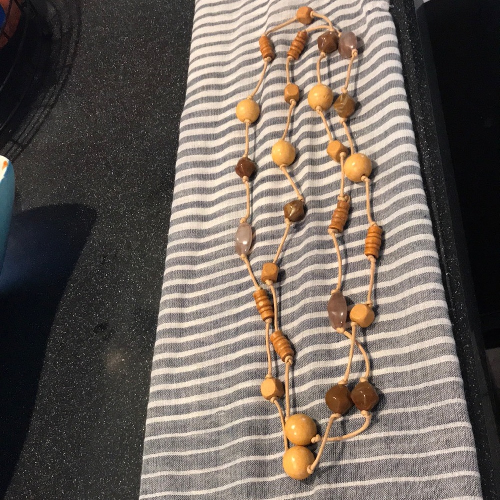 Natural wood beaded necklace on knotted cord